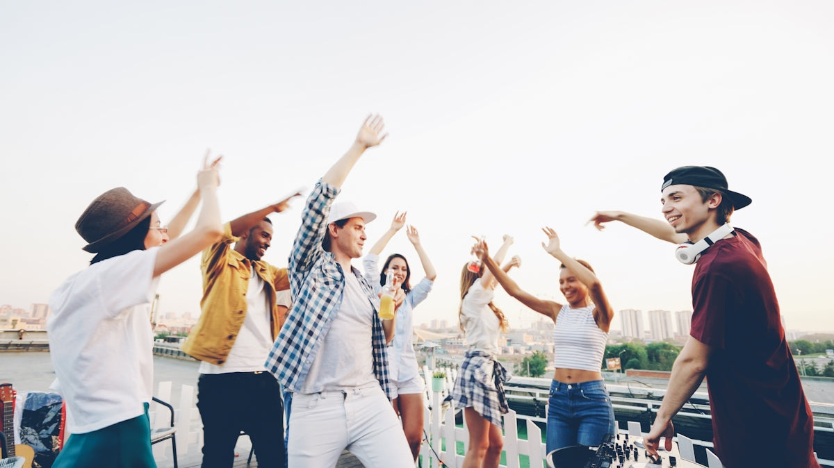 Group of young people dancing on a rooftop